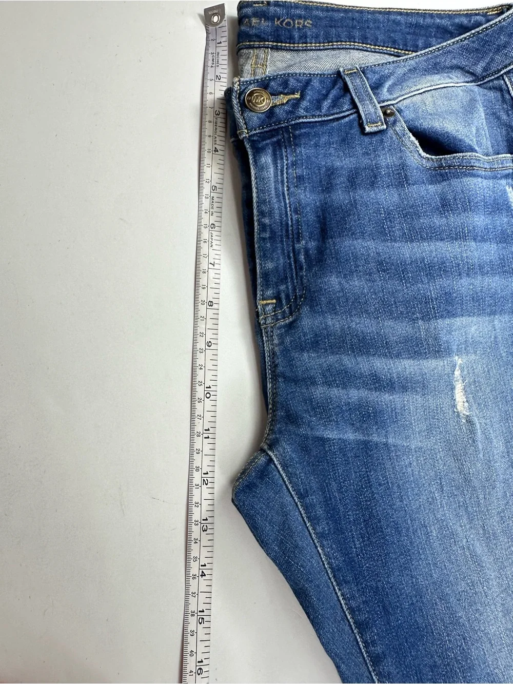 Michael Kors Women's Dark Blue Skinny Jeans with Subtle Distressing